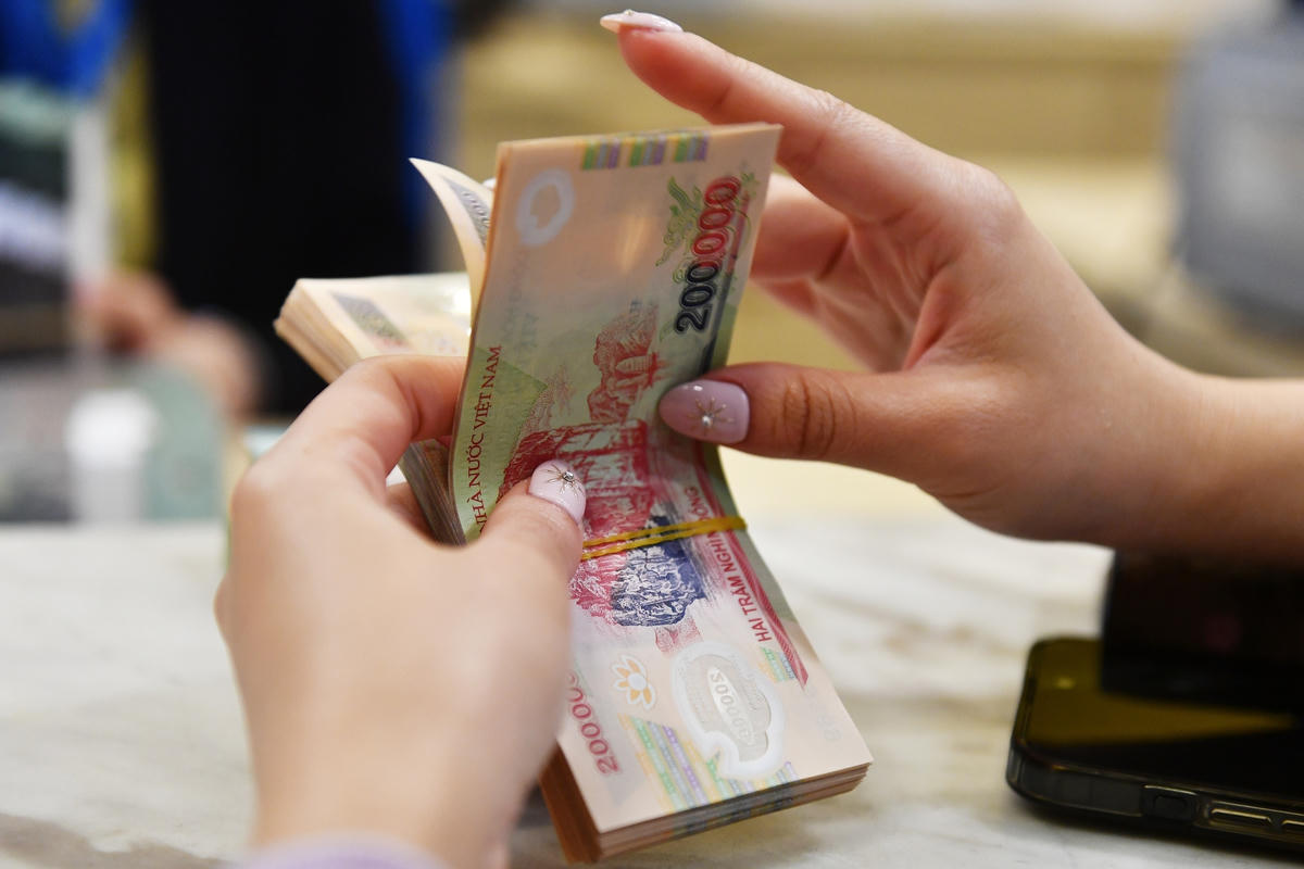 Mặt bằng lãi suất tiếp tục điều chỉnh giảm, hỗ trợ tăng trưởng tín dụng. (Ảnh minh họa).