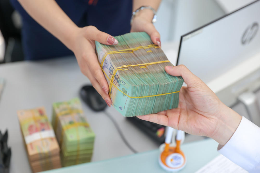 Tiền gửi của người dân tại ngân hàng tăng hơn 152.000 tỷ đồng trong tháng 7. (Ảnh minh họa)